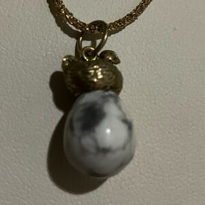 Antique fabrege hen egg pendent in bow mite stone and 14 k gold .